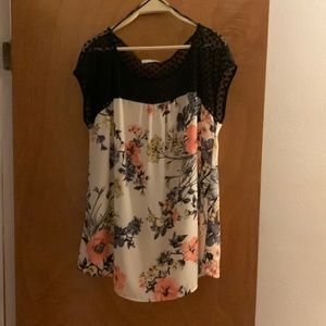 Sleeveless floral print with black lace around the neckline
